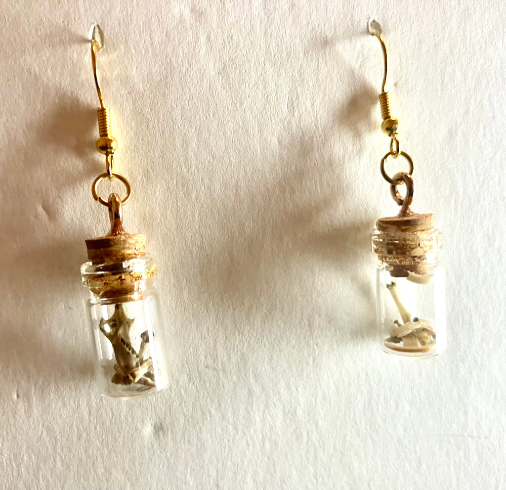 Tiny bone filled vial earrings