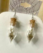 Tiny bone filled vial earrings