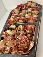 Coffin with blood splattered book roses