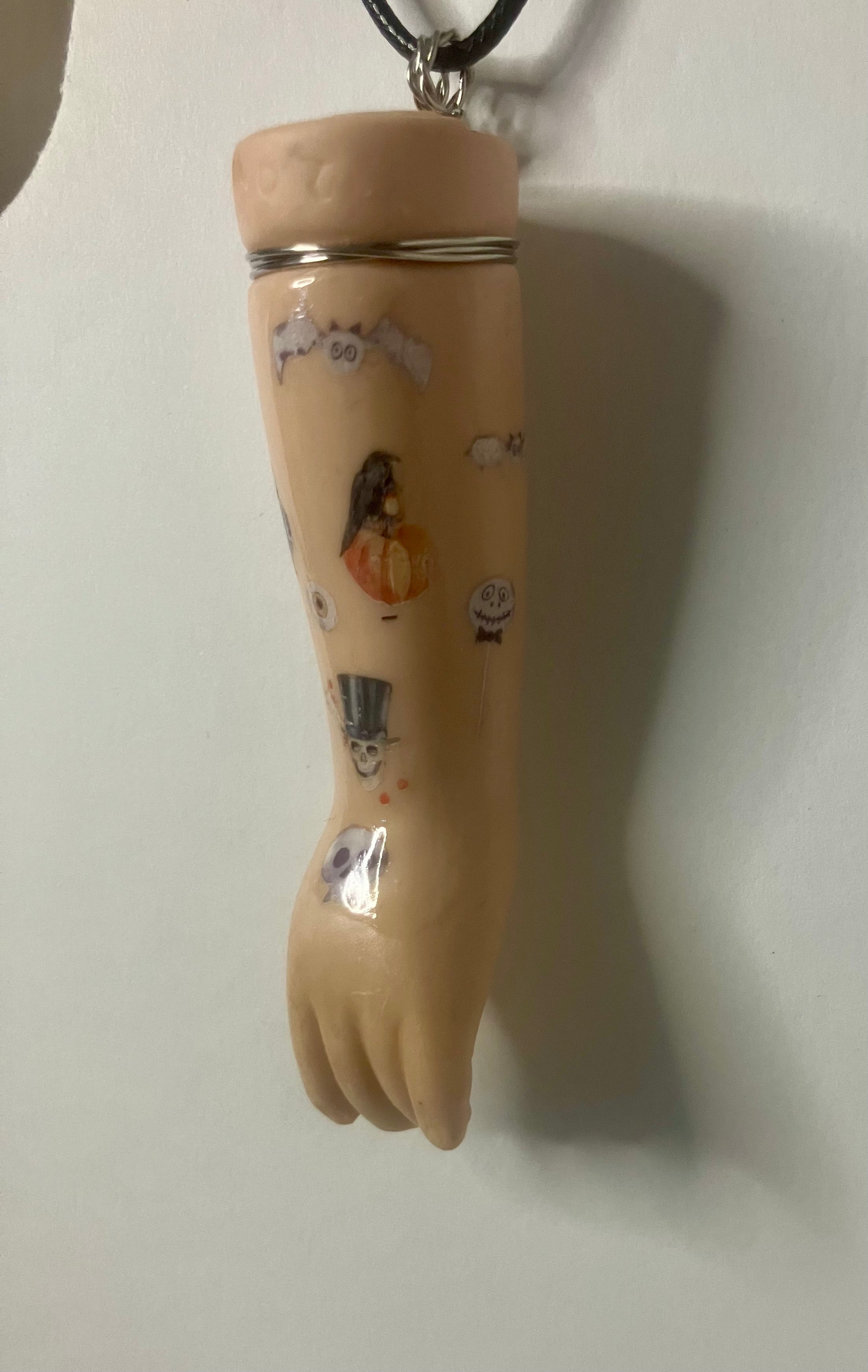 Baby arm necklaces
