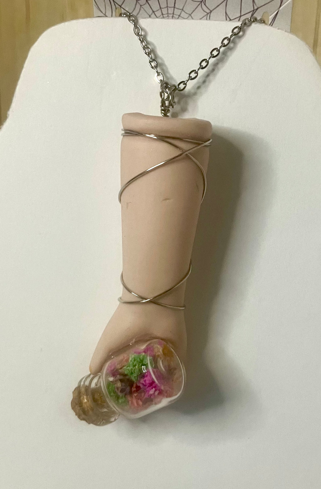 Baby arm necklaces
