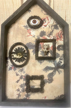 Shadow box houses with small framed bones