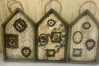 Shadow box houses with small framed bones