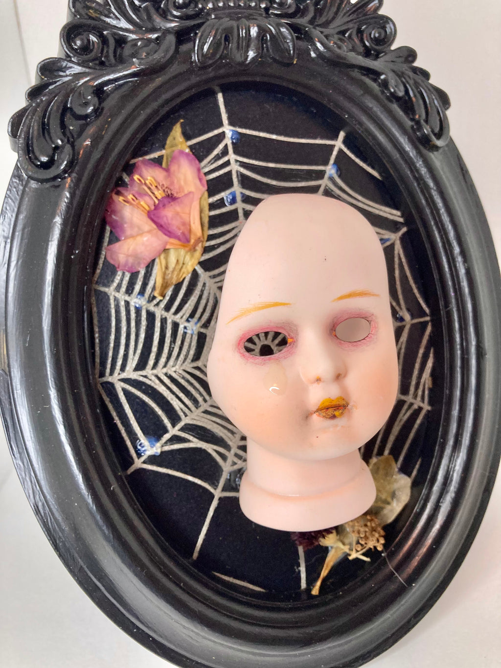Weeping broken doll