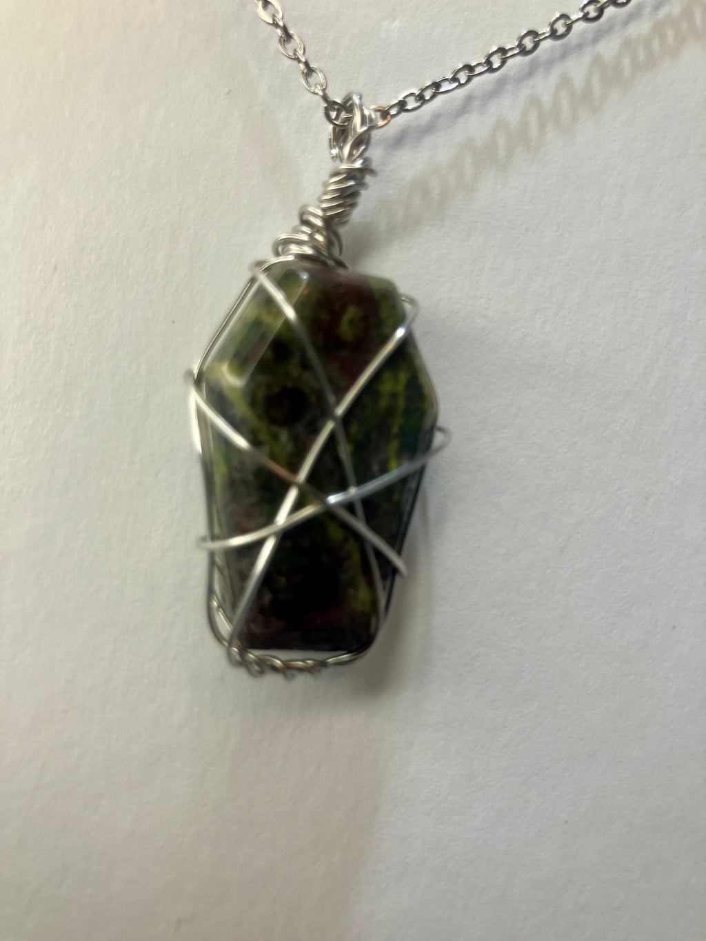 Wire wrapped stones and crystals with stainless steel wire