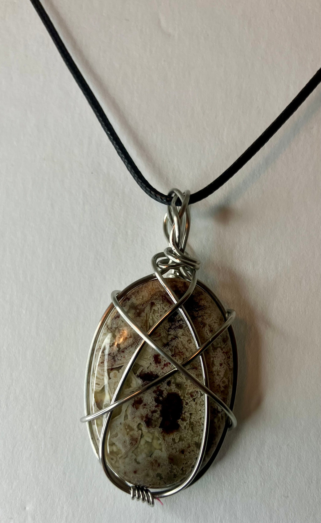 Wire wrapped stones and crystals with stainless steel wire