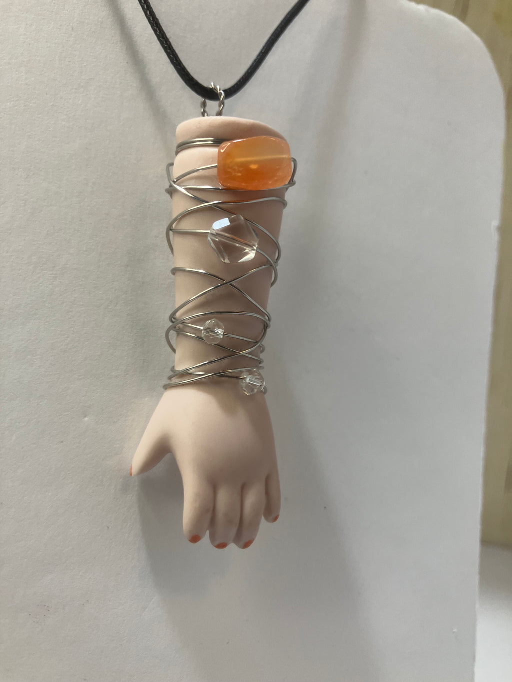 Baby arm necklaces