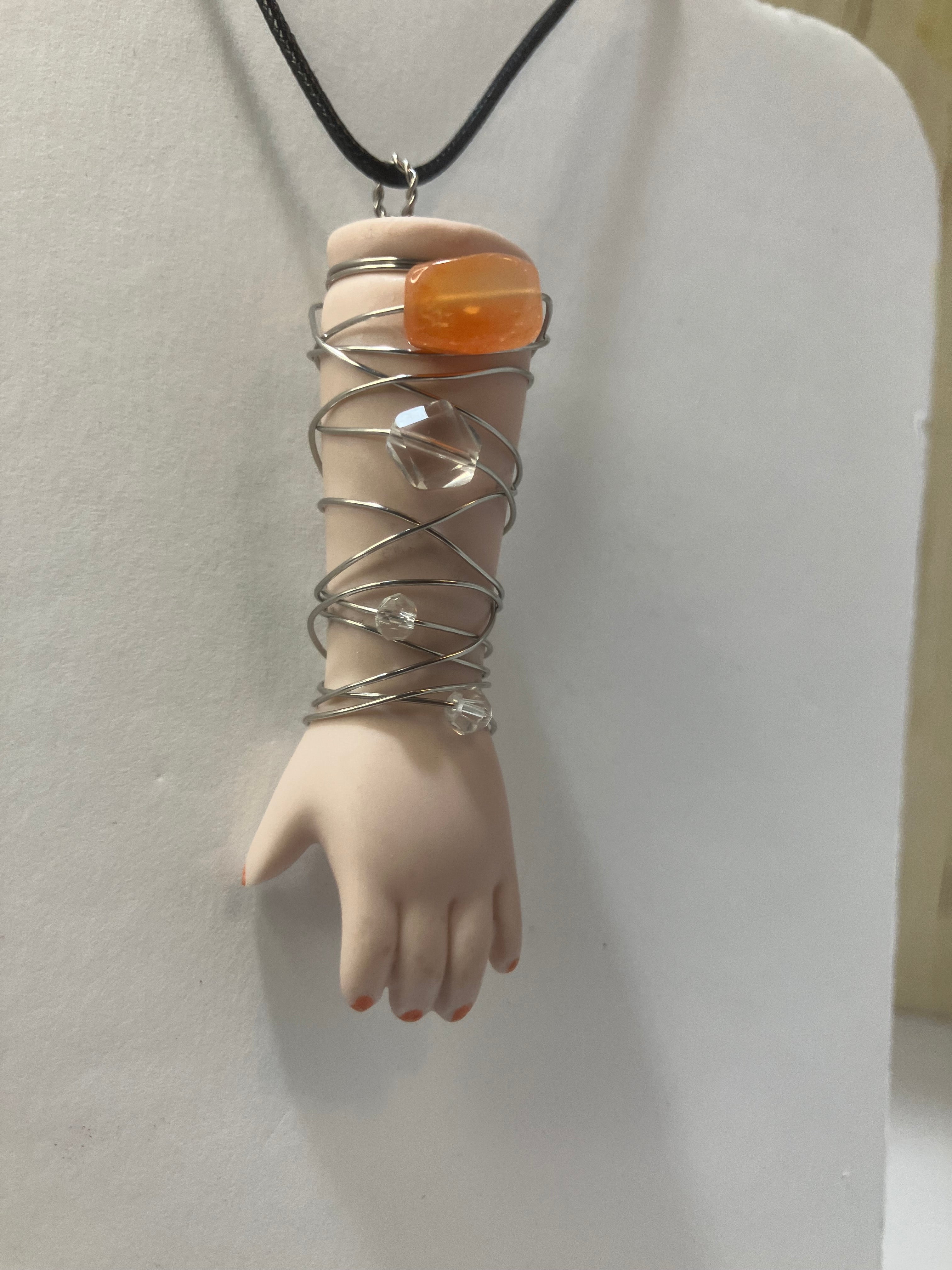 Baby arm necklaces