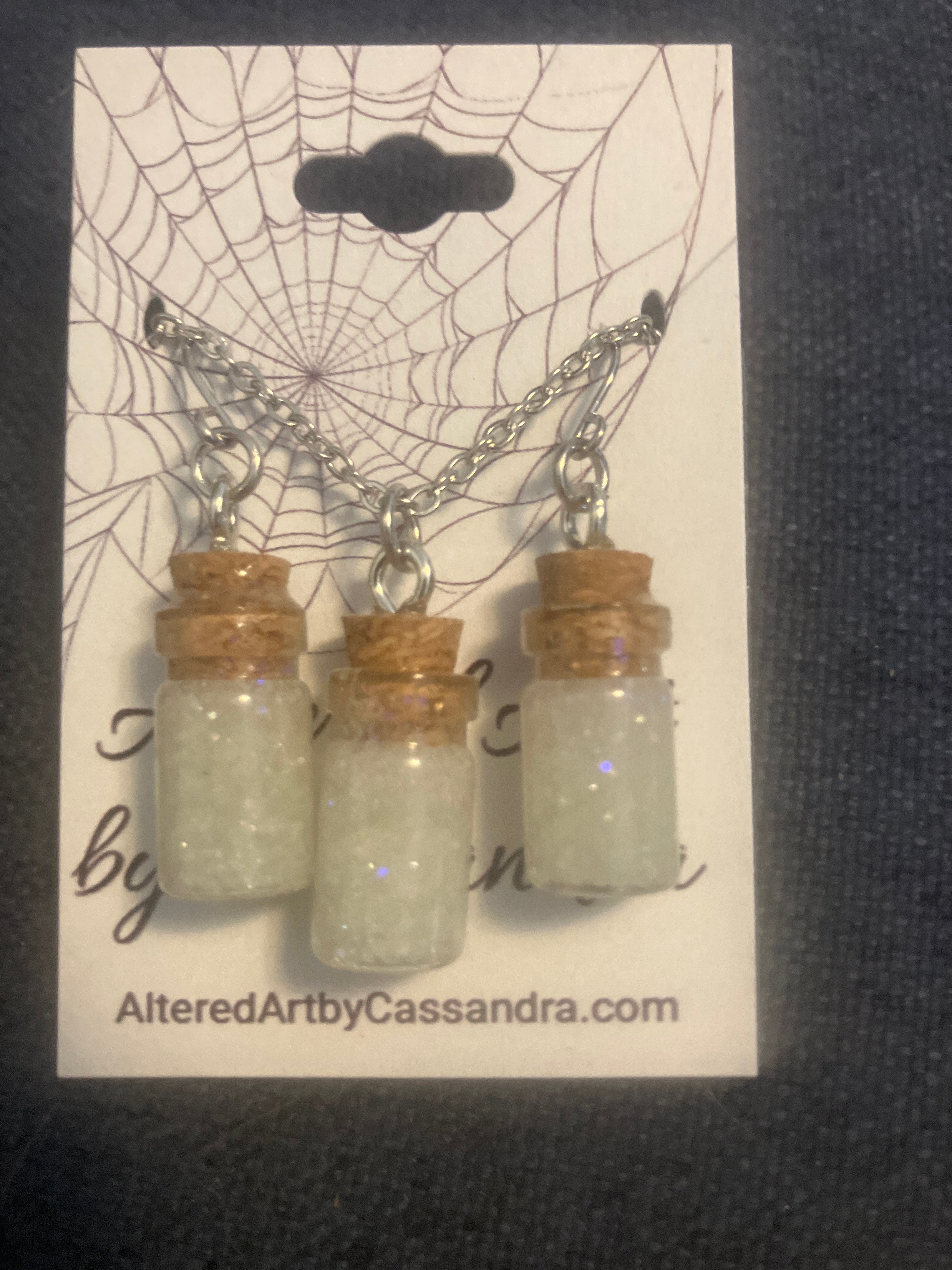 Tiny bone filled vial earrings