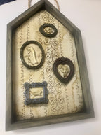 Shadow box houses with small framed bones