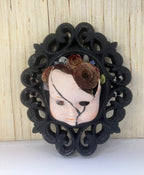 Pouty broken doll art