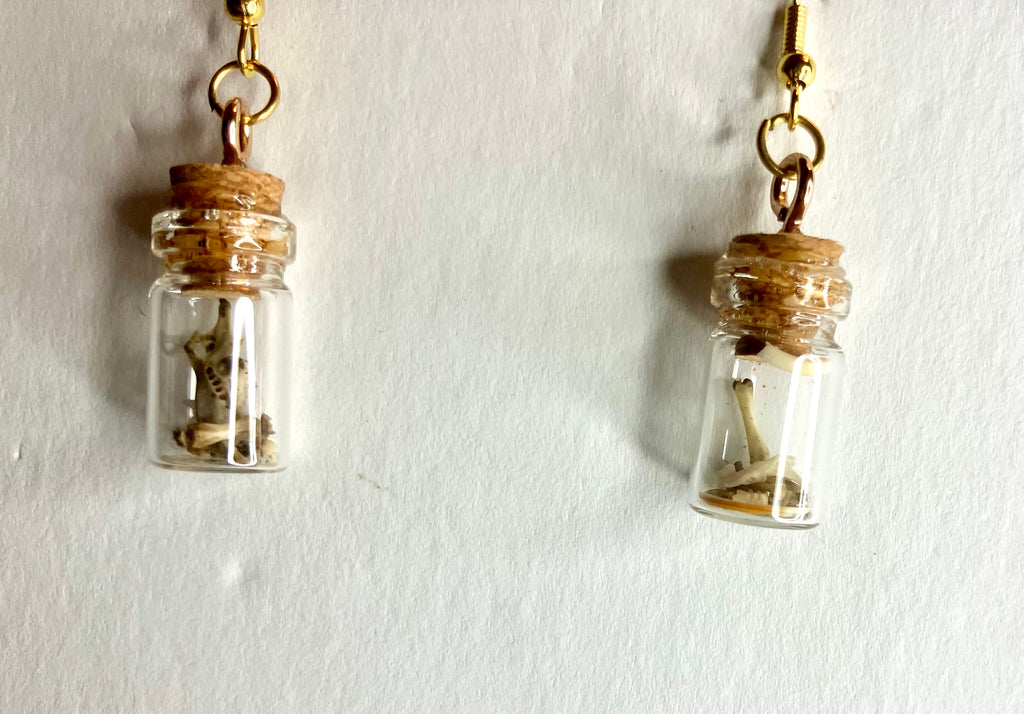 Tiny bone filled vial earrings