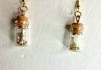 Tiny bone filled vial earrings