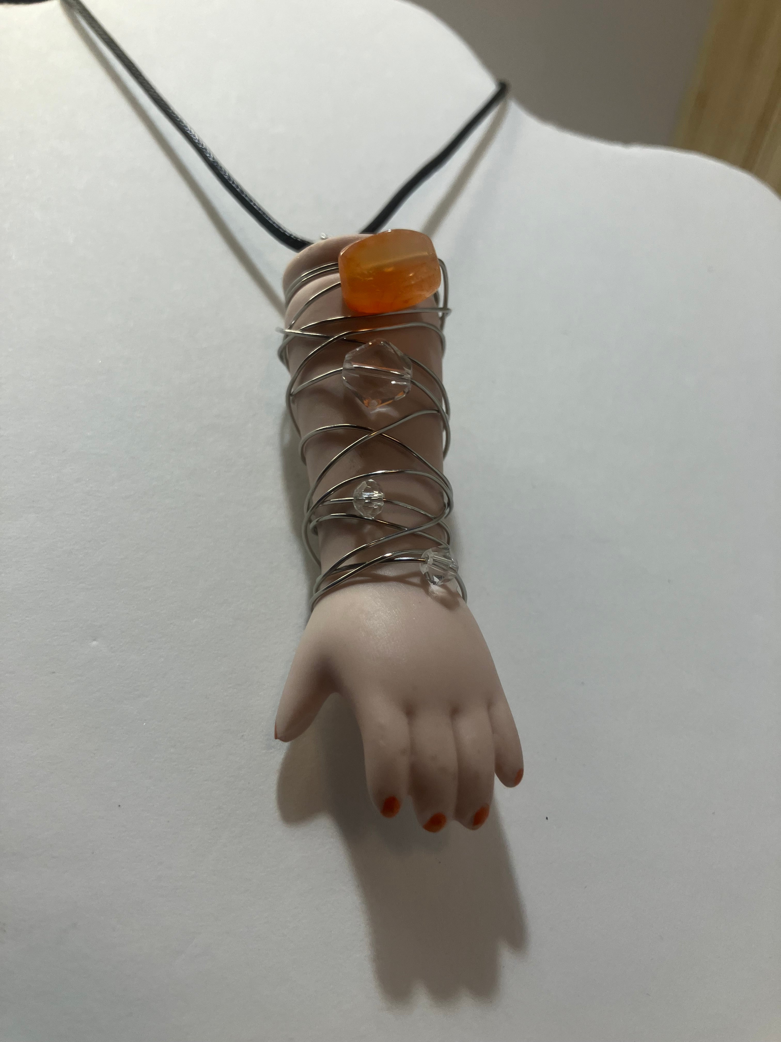 Baby arm necklaces