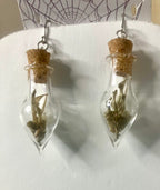 Tiny bone filled vial earrings